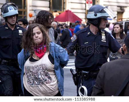 NEW YORK - SEPT 17: An unidentified woman being arrested on the 1yr anniversary of the Occupy Wall St protests on September 17, 2012 in New York City, NY.
