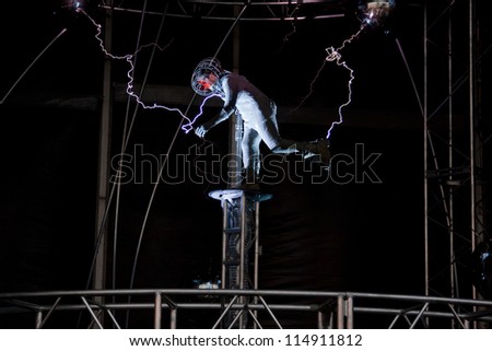 NEW YORK - OCT 6: Endurance artist David Blaine is struck by a spark of electric current from a Tesla coil during the live streaming event called \'Electrified\' in New York on October 6, 2012.