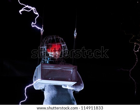 NEW YORK - OCT 6: Endurance artist David Blaine is struck by a spark of electric current from a Tesla coil during the live streaming event called \'Electrified\' in New York on October 6, 2012.