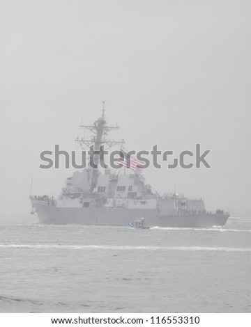 NEW YORK - OCT 9: USS Michael Murphy (DDG 112) departing New York Harbor in rain and fog after being commissioned in New York on October 9, 2012. Lt Murphy was a Navy SEAL who was killed in combat.