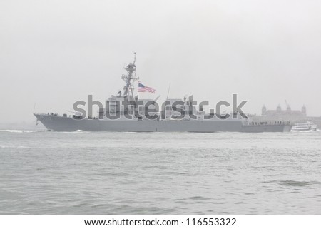 NEW YORK-OCT 9: USS Michael Murphy (DDG 112) departing New York Harbor in rain and fog after being commissioned into service in New York on October 9, 2012. Lt Murphy was a Navy SEAL killed in combat.