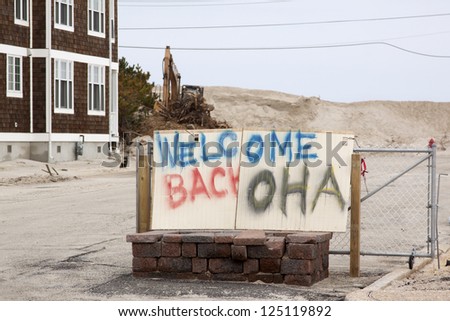 CHADWICK, NJ - JAN 13: A spray painted sign reads 'Welcome Back OHA' on January 13, 2013 in Chadwick, New Jersey. Clean up continues 75 days after Hurricane Sandy struck the shore in October 2012.