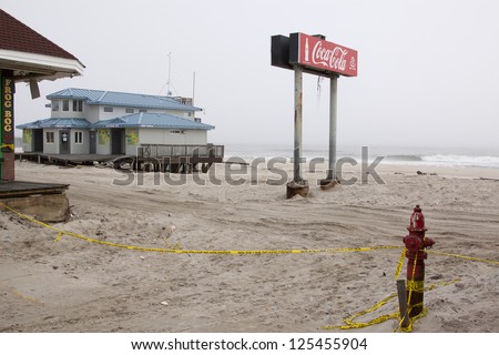 SEASIDE HEIGHTS, NJ - JAN 13:The Coca Cola sign and comfort station in the fog on January 13, 2013 in Seaside Heights, New Jersey. Clean up continues 75 days after Hurricane Sandy hit in October 2012.