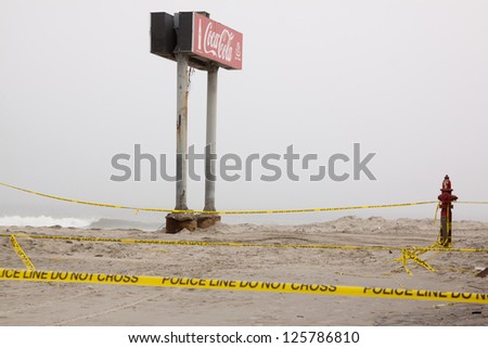 SEASIDE HEIGHTS, NJ - JAN 13:The boardwalk Coca Cola sign in the fog on January 13, 2013 in Seaside Heights, New Jersey. Clean up continues 75 days after Hurricane Sandy hit the shore in October 2012.