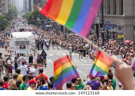 NEW YORK-JUN 30: Rainbow flags are wave in celebration as thousands of spectators line the sidewalks for the 44th Annual NYC Pride March down 5th Avenue on June 30, 2013 in Manhattan.