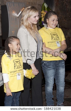 NEW YORK-APR 21, 2014: Unidentified children from Project Sunshine meet Actress Abigail Breslin at the ceremony to light the Empire State Building in yellow in honor of Project Sunshine Week.