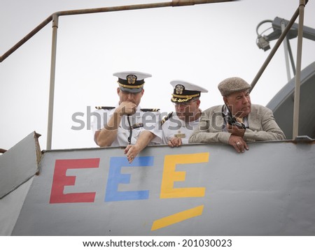 STATEN ISLAND, NY - MAY 21: The conning officer, commander, and harbor master aboard the USS Cole (DDG 067) guide the ship into port at Sullivans Piers for Fleet Week NY on May 21, 2014.