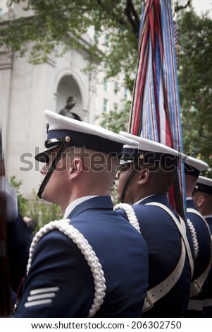 NEW YORK - MAY 23: Members of the US Coast Guard Silent Drill Team perform in Herald Square in front of the Macys store during Fleet Week NY on May 23, 2014.
