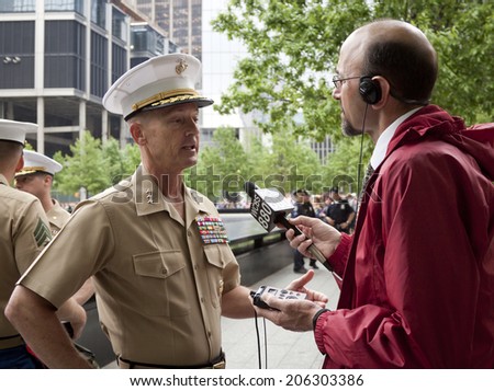NEW YORK - MAY 23, 2014: U.S. Marine Lt. General William Faulkner interviewed by Peter Haskell of WCBS 880 after the re-enlistment and promotion ceremony at the National September 11 Memorial site.