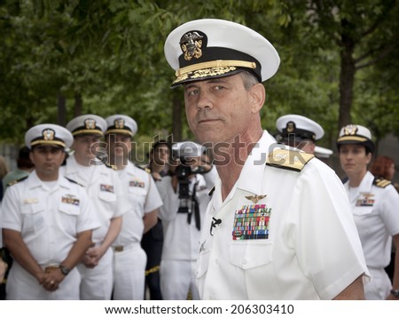NEW YORK - MAY 23, 2014: A portrait of Rear Admiral Scott A. Stearney standing in front of US Navy officers during the re-enlistment and promotion ceremony at the National September 11 Memorial site.