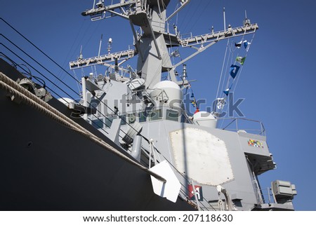 STATEN ISLAND, NY - MAY 25, 2014: Low angle port side view of the hull and bridge on the guided-missile destroyer USS Cole (DDG 067) moored during Fleet Week NY at Sullivans Piers on May 25, 2014.