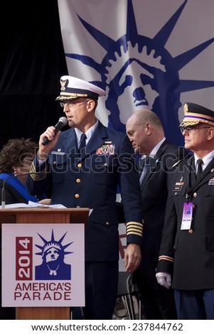 NEW YORK - NOV 11, 2014: Captain Gordon Loebl speaks to the crowd from the VIP viewing stage during the 2014 America\'s Parade held on Veterans Day in New York City on November 11, 2014.