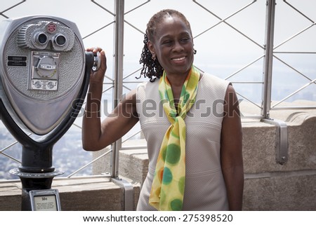NEW YORK - MAY 5, 2015: New York First Lady Chirlane McCray poses on the observatory deck of the Empire State Building after a ceremony to bring awareness for mental health needs and services in NYC.
