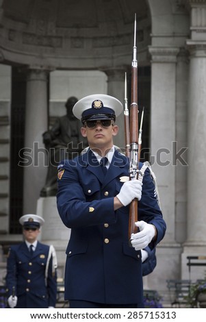 NEW YORK - MAY 21 2015: A member of the US Coast Guard Ceremonial Honor Guard Silent Drill Team performing next to the New York Public Library in Bryant Park during Fleet Week NY 2015.