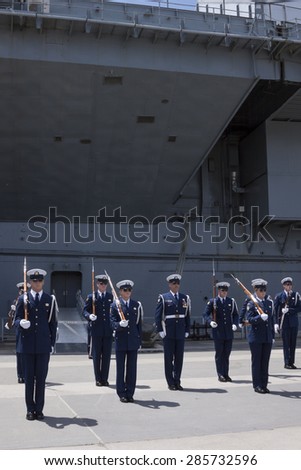 NEW YORK - MAY 22 2015: The US Coast Guard Ceremonial Honor Guard Silent Drill Team perform on Pier 92 next to the Intrepid Sea, Air, and Space Museum during Fleet Week NY 2015.