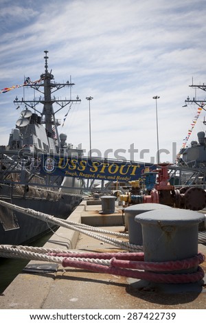 STATEN ISLAND, NY - MAY 24 2015: The ships banner of the guided-missile destroyer USS Stout (DDG 55) hangs from the metal gangplank while moored at Sullivans Pier during Fleet Week NY 2015.