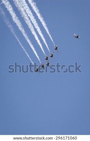 NEW YORK - MAY 22 2015: US Air Force Thunderbird F-16 jets perform the Missing Man Formation aerial salute above Manhattan with precision during Fleet Week NY 2015, part of Memorial Day celebrations.