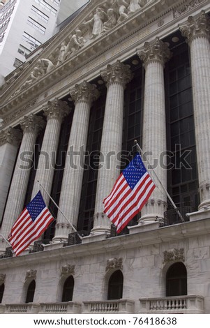 NEW YORK - MAY 2: U.S. Flags wave outside the New York Stock Exchange on May 2, 2011 in New York City. Osama bin Laden was killed in Pakistan by US Seals the day before.