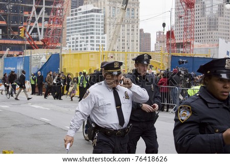NEW YORK - MAY 2: NYPD officers walk near Trade Center PATH train station on May 2, 2011 in New York City. Osama bin Laden was killed in Pakistan by US Seals the day before.