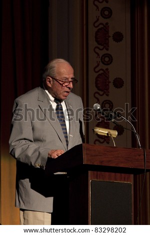 CAMDEN, ME- AUGUST 13: Rusty Brace, Camden Public Library Trustee, President gives welcome speech for author David McCullough (The Greater Journey) at Camden Opera House August 13, 2011 in Camden, ME