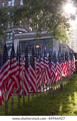 NEW YORK - SEPT 11, 2011: Flags that honor the fallen firefighters are shown at the Firefighters Memorial on September 11, 2011 in New York. Today is the 10TH anniversary of the terror attacks.