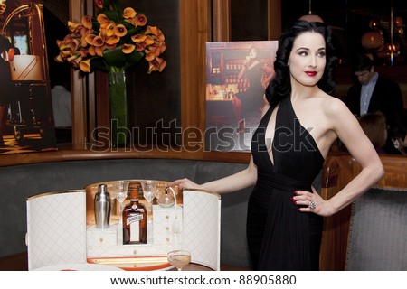 NEW YORK - NOV 15: Dita Von Teese launches “My Cointreau® Travel Essentials” vintage-inspired travel bar, at Forty Four|Royalton on November 15, 2011 in New York City, NY.