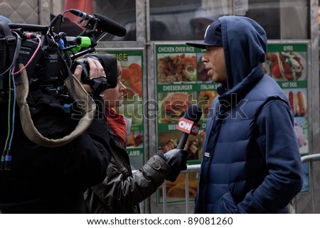 NEW YORK - NOV 17: Hip-hop mogul Russell Simmons gives a television news interview on the \'Day of Disruption\' outside of Zuccotti Park on November 17, 2011 in New York City, NY.
