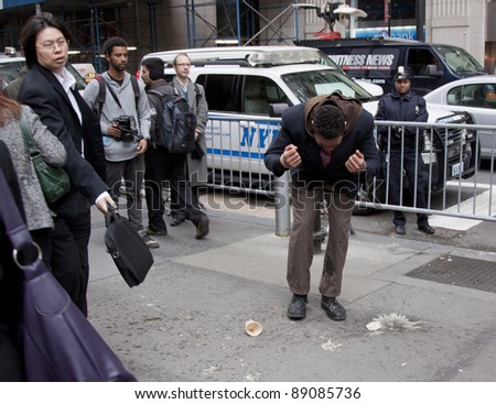 NEW YORK- NOV 17:An unidentified man becomes upset after failing to provide proper identification at police checkpoint during Occupy protests on Broadway on November 17, 2011 in New York City.