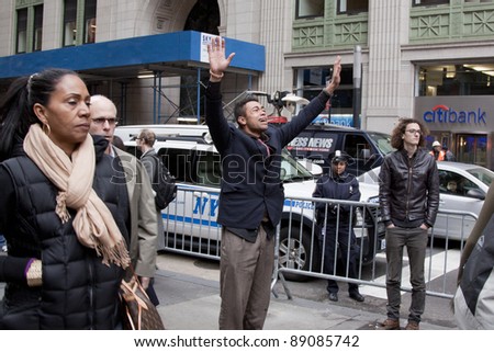 NEW YORK- NOV 17:An unidentified man becomes upset after failing to provide proper identification at police checkpoint during Occupy protests on Broadway on November 17, 2011 in New York City.