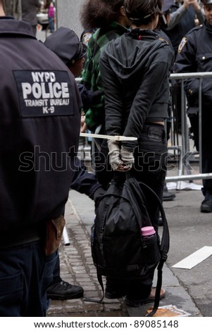 NEW YORK - NOV 17:  An unidentified woman arrested at Broad & Beaver Streets on November 17, 2011 in New York City, NY. Dubbed \'Day of Disruption\', it is the 2 month mark since the movement began.
