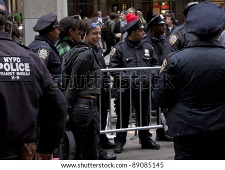 NEW YORK - NOV 17:  An unidentified woman smiles after being arrested at Broad & Beaver Streets on November 17, 2011 in New York City, NY.Today is the 2 month mark since the OWS movement began.