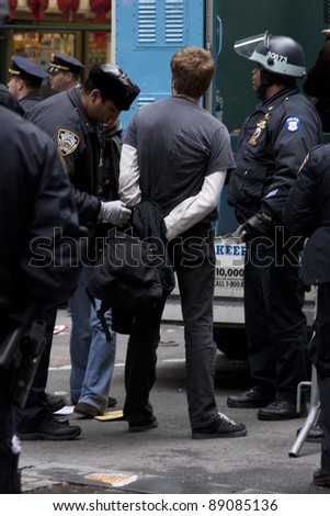 NEW YORK - NOV 17:  An unidentified man being arrested at Broad & Beaver Streets on November 17, 2011 in New York City, NY. Dubbed \'Day of Disruption\', it is the 2 month mark since the movement began.