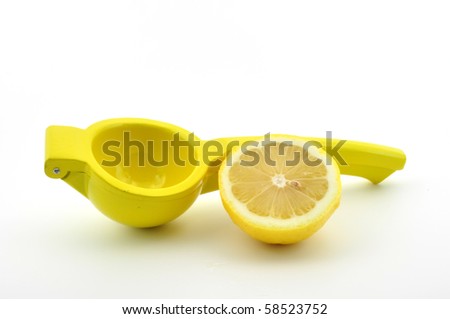 lemon squeezer with half a lemon isolated on white