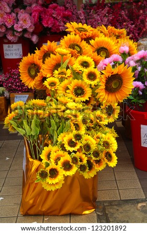 Plastic decorative sunflower sales during festive season.