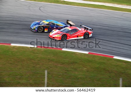 SEPANG, MALAYSIA-JUNE 20 : Autobacs Aguri car 43 lost control and ramp into Tokai Dream car 2, at Super GT car race round 4 on June 20, 2010 in Sepang Circuit, Malaysia.