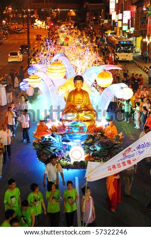 KUALA LUMPUR MALAYSIA MAY 28 Thousand Buddhist believers beside the largest floats at the Wesak Day procession in front Petaling Street on May 28 2010 in Kuala Lumpur Malaysia KUALA LUMPUR MALAYSIA MAY 28 Thousand Buddhist believers beside the largest floats at the Wesak Day procession in front Petaling Street on May 28 2010 in Kuala Lumpur Malaysia