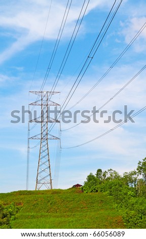 Power cable tower on a hill. Concept of power transmission.