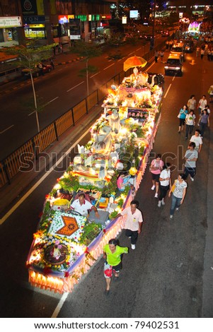 KUALA LUMPUR, MALAYSIA-MAY 17: A float with rabbit mannequins parading on Wesak Day procession at Petaling Street, Malaysia on 17 May,2011.