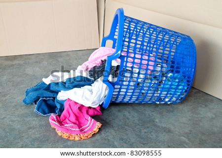 Basket full of dirty laundry. Concept of daily household chores.