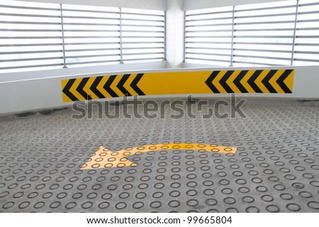 Corner way with anti-slip road texture and road signs. Concept of road safety features.