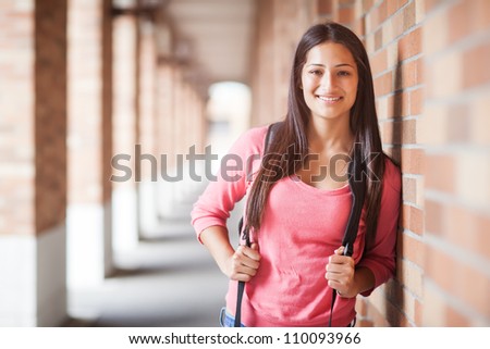 A portrait of a hispanic college student at campus
