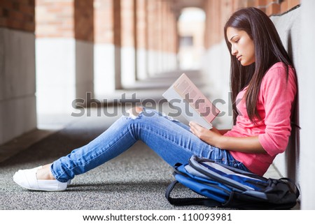 A shot of a hispanic college student studying on campus