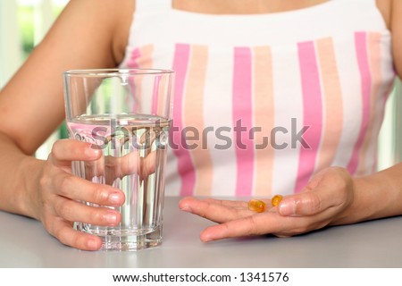 A woman taking vitamin