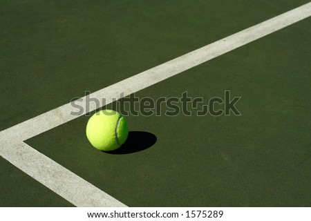 A tennis ball in a tennis court