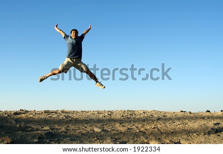 A happy man jumping in the air
