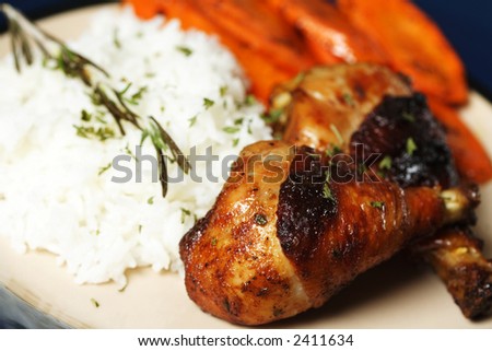 Barbecue chicken meal with rice and carrots