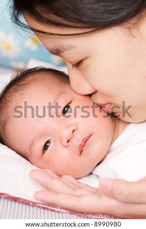 Black And Asian Mixed Baby. 2010 lack asians lack and asian mixed baby. stock photo : An asian mother