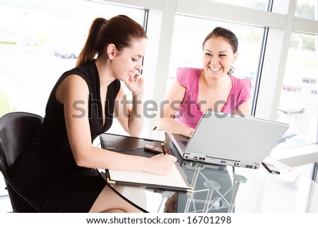 Two businesswomen in a meeting at the office