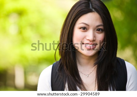 A shot of a beautiful asian college student on campus
