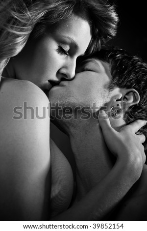 A shot of a man and a woman in love kissing